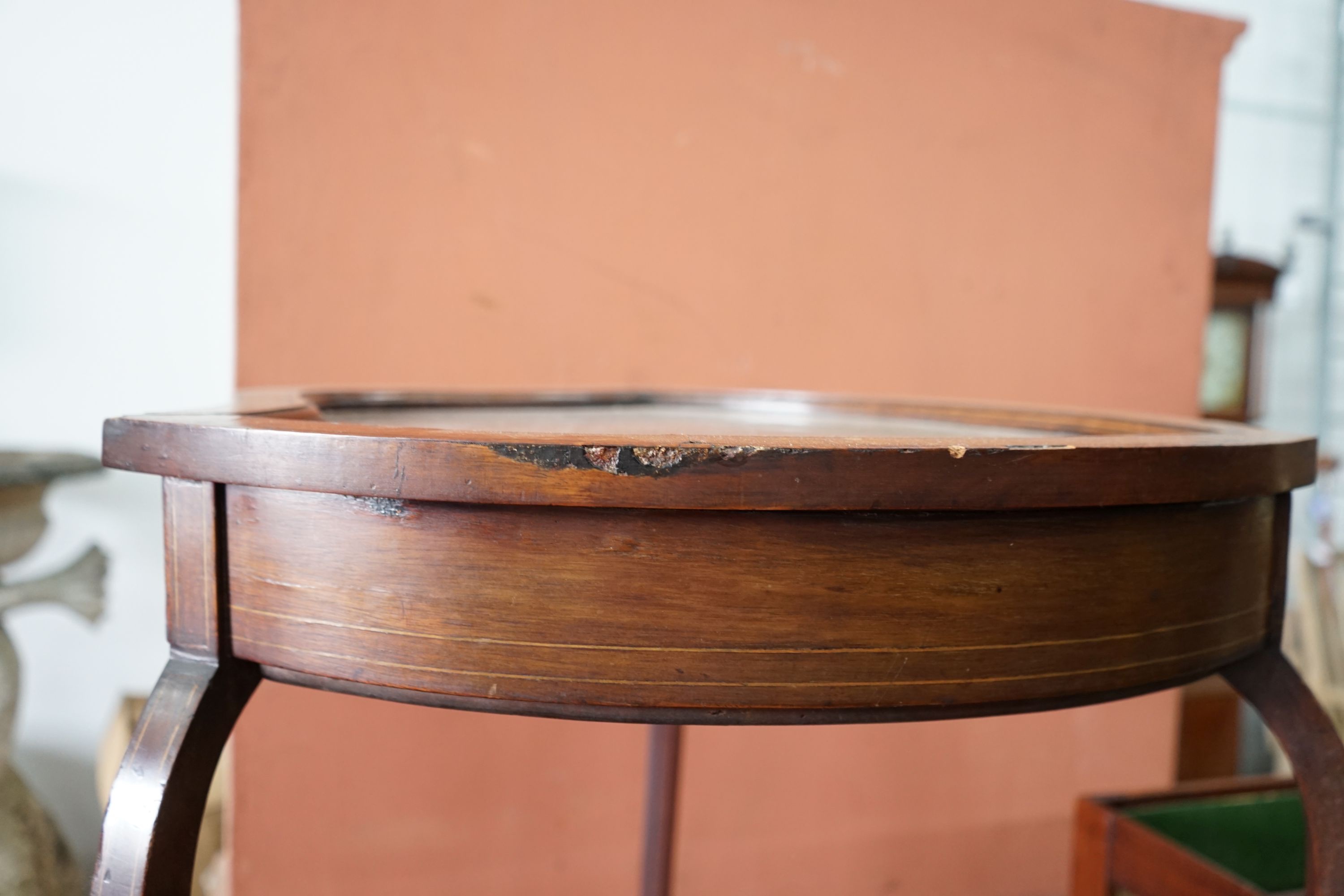 An Edwardian mahogany shield shaped bijouterie table, width 50cm, depth 59cm, height 72cm